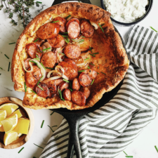 Parmesan Herb Dutch Baby with Sausage & Onions